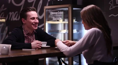 Couple in cafe having a conversation and drinking coffee Stock Footage 61848156