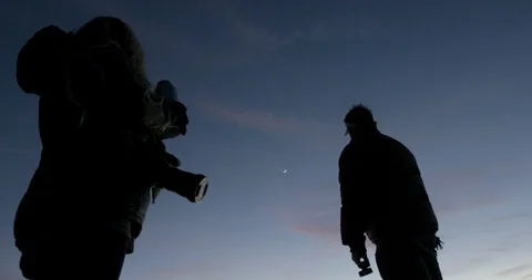 Couple with camera looking at the sky Stock Footage 145282253