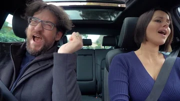 Couple in car dancing making funny faces expression slow motion Stock Footage 85616756