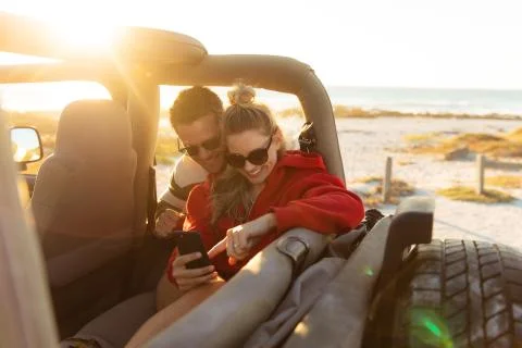 Couple with a car enjoying free time Stock Photos