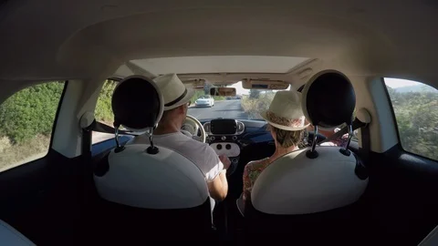 Couple in the car he is driving, both are wearing a hat Stock Footage 115106887