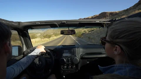 Couple in Car on Mountain Road Stock Footage 97127096