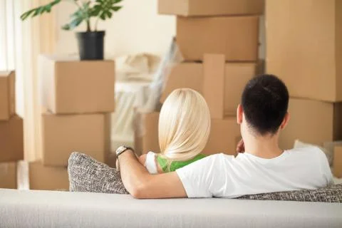 Couple with cardboard boxes Stock Photos