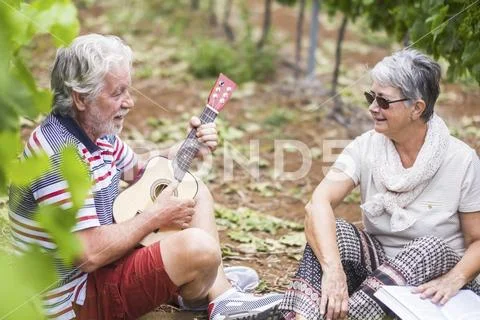 Couple of caucasian adult senior stay together outdoor in leisure activity pl Stock Photos