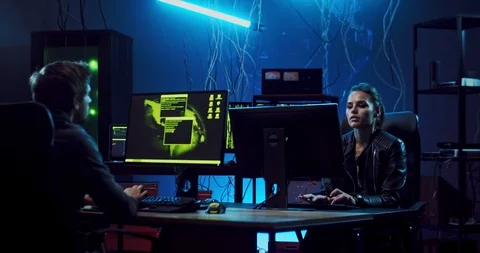 Couple of Caucasian software developers, man and woman sitting at the computers Stock Footage 124349960