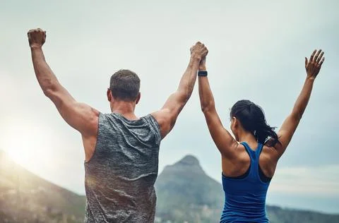 Couple, celebration and arms up in nature for training, workout or exercise to Stock Photos