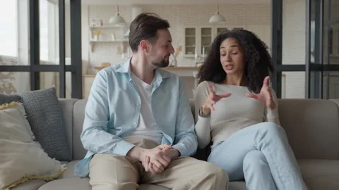 Couple Chatting while Sitting on the Couch Stock Footage 294322052