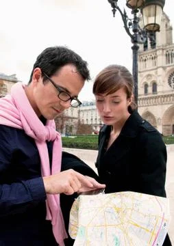 Couple check map in Paris Stock Photos