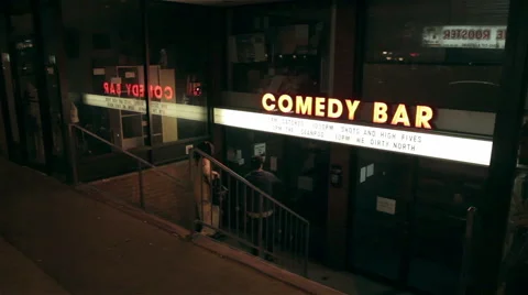 Couple check out show at Comedy Bar Exterior Stock Footage