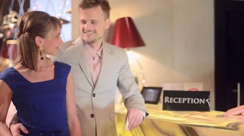 Couple checking in at the hotel Stock Footage 61237239