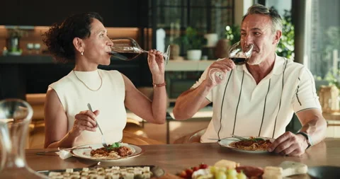 Couple, cheers and dining with wine glass in home for romantic date, dinner or Stock Footage 346243840