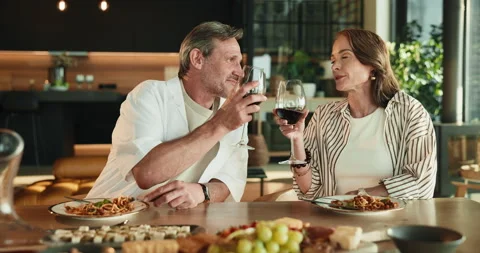 Couple, cheers and dining with wine glass for romantic date, dinner or meal Stock Footage 346281601