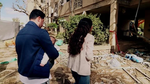 A couple with a child by the ruins Stock Footage 332615219