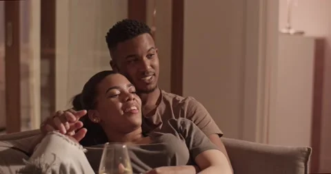 Couple chilling on sofa during showtime Video stock 181712652