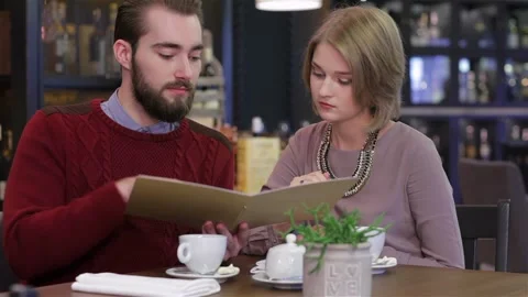 Couple chooses the menu Stock Footage 252597709