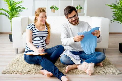 Couple choosing clothes Stock Photos