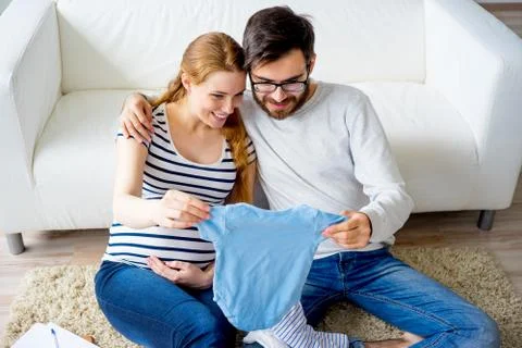Couple choosing clothes Stock Photos