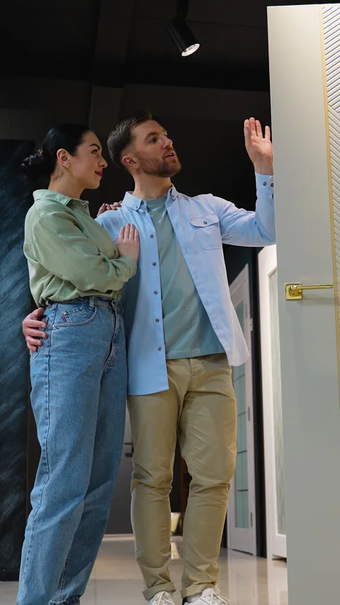 Couple choosing interior design elements with consultant Stock Footage 310818101