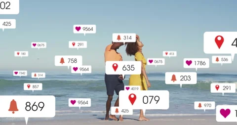 Couple clasping hands and dancing on beach while floating social media icons Stock Footage 314408836