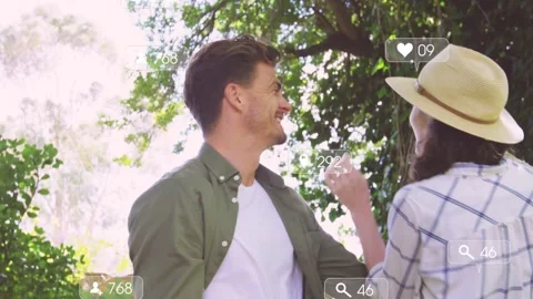 Couple clasping hands under tree, cheering and sparking social media likes 스톡 동영상 332523329