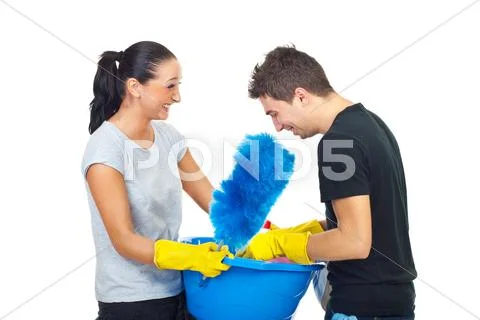 Couple with cleaning products having fun Stock Photos