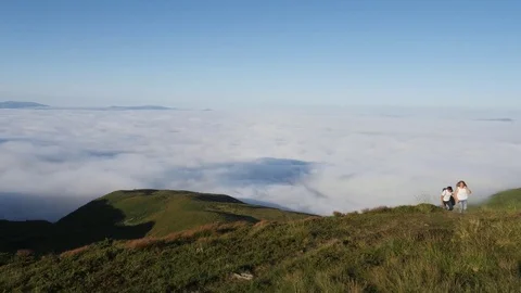 Couple climbing mountain range. Stock Footage 81276997