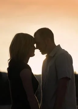 Couple close at sunset Stock Photos