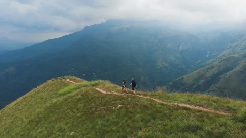 Couple come down from mountain Stock Footage 109423210