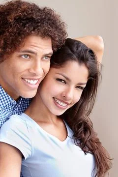 Couple, commitment and hugging in studio, love and bonding in relationship on 库存照片