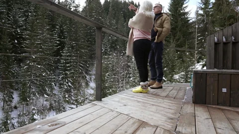 A couple communicates while standing on the terrace of a house. Stock-Footage 265179138