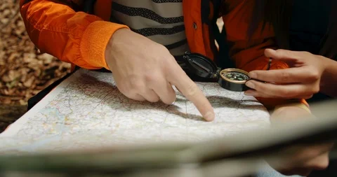 Couple with Compass and Map Direction Видео 115288369
