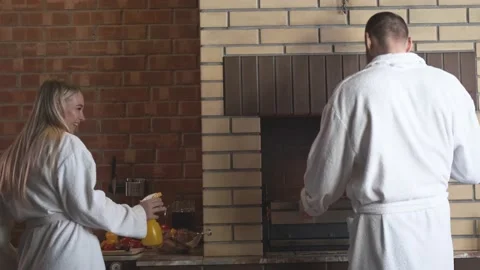 The couple is cooking dinner. Fireplace. Stock Footage 151099800