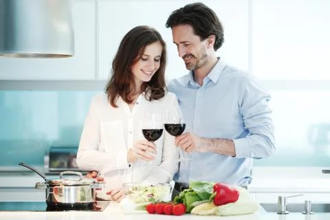 Couple cooking dinner Stock Photos