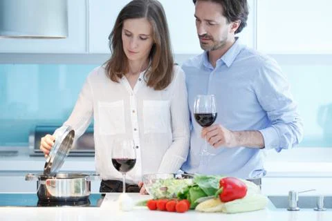 Couple cooking dinner Stock Photos