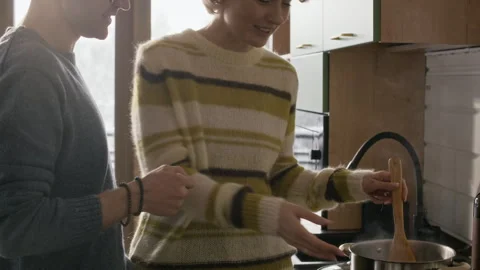 Couple Cooking in Kitchen While Using Smartphone Stock Footage 341301286