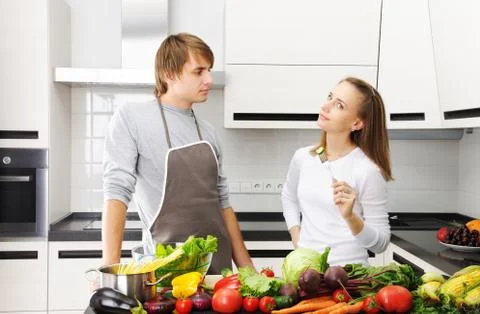 Couple cooking Stock Photos