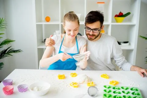 Couple cooking together Stock Photos