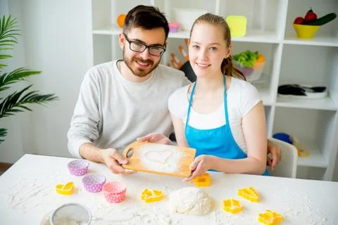 Couple cooking together Stock Photos