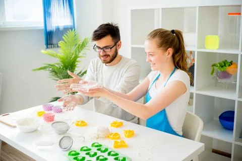 Couple cooking together Stock Photos