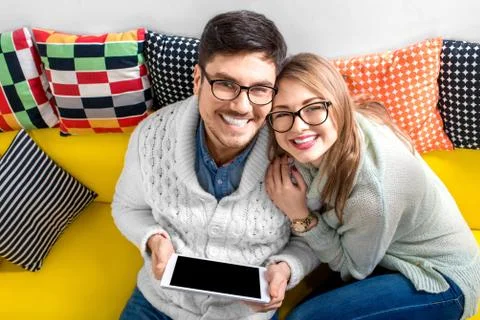 Couple on the couch at home Stock Photos