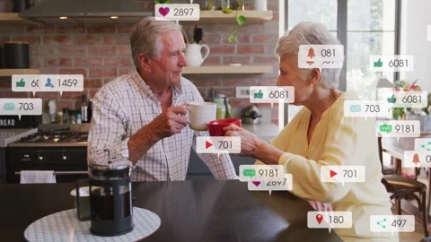 Couple at counter sharing coffee, tapping mugs while incoming marketing badges 스톡 동영상 332936553
