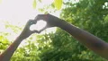 Couple crossing hands in heart shape, endless love, homosexual orientation HD Footage