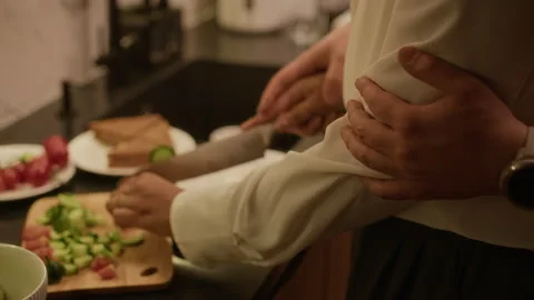 Couple Cutting Cucumber Together Vídeo Stock 331787529