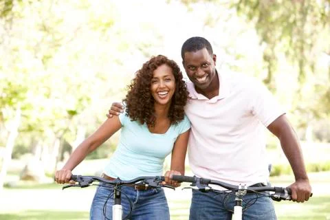 Couple On Cycle Ride in Park Stock Photos