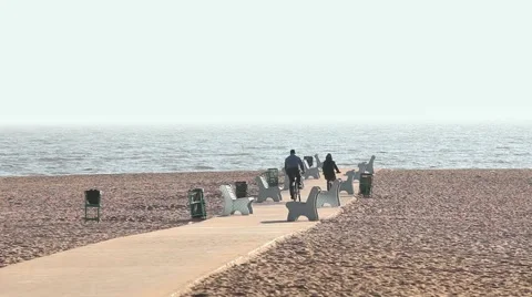 Couple Cyclists riding on the beach Stock Footage 56436639