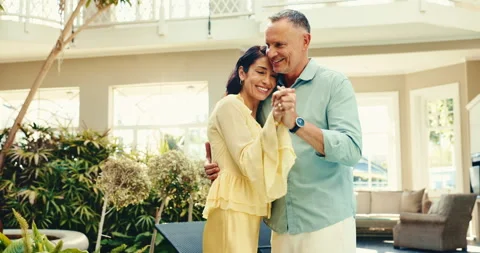 Couple, dance and holding hands on date, resort and bonding with partner on Stock Footage 345651529