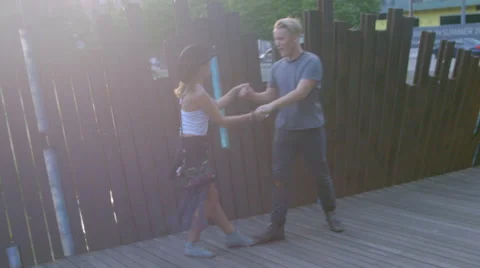 Couple dance on park path Stock Footage 54068257