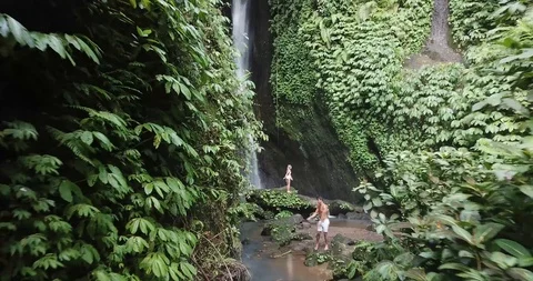 Couple Dance at Waterfall Flossing Drone Shot Stock Footage 106787246