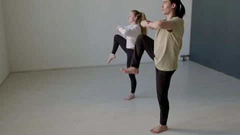 Couple of Dancers Doing Hip Rotation Exercise in Studio Stock Footage 282525917