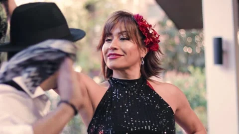 A couple of dancers in formal attire, dancing the cueca brava Stock Footage 337015525